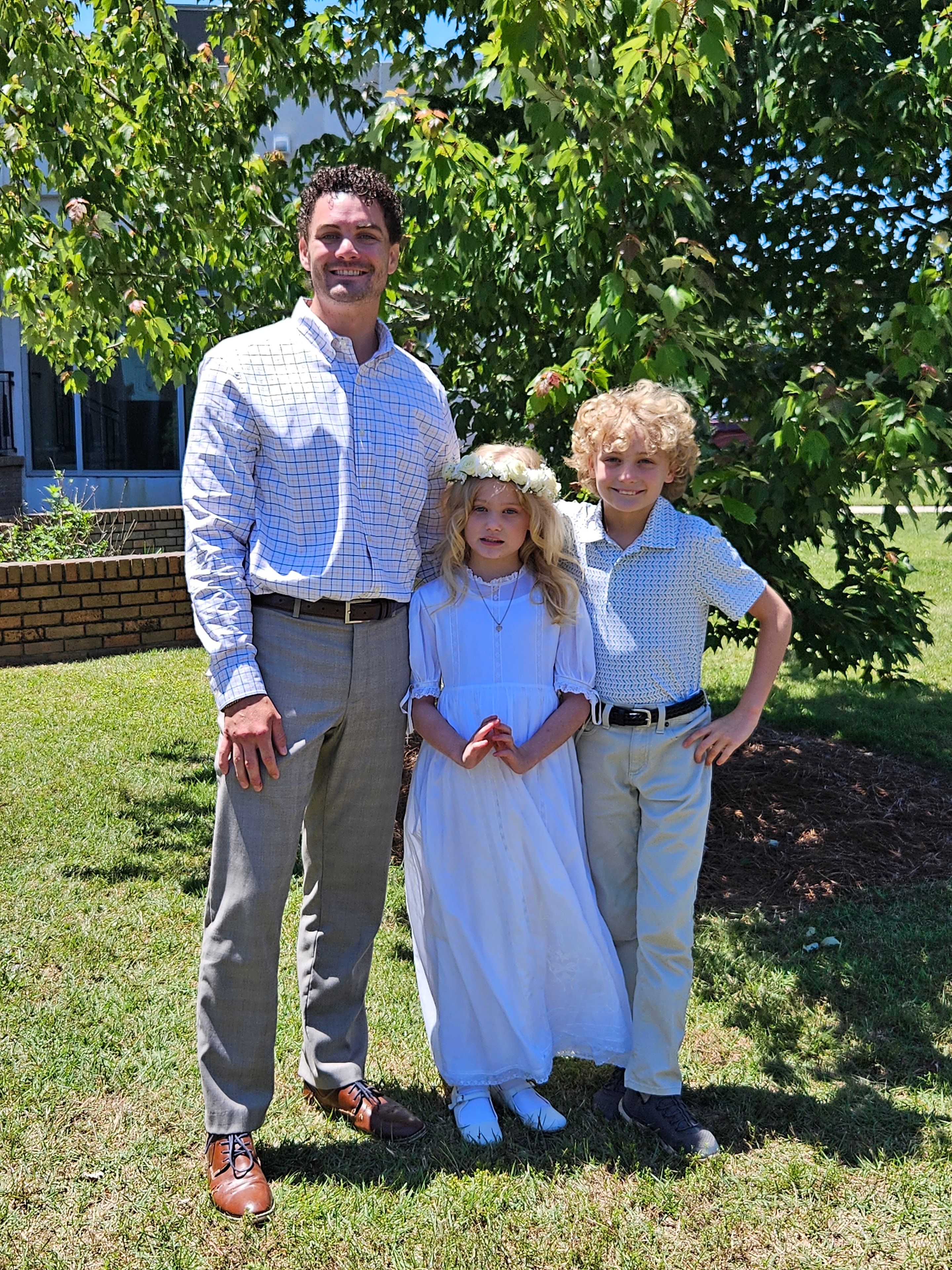 Eli with family dressed up outdoors